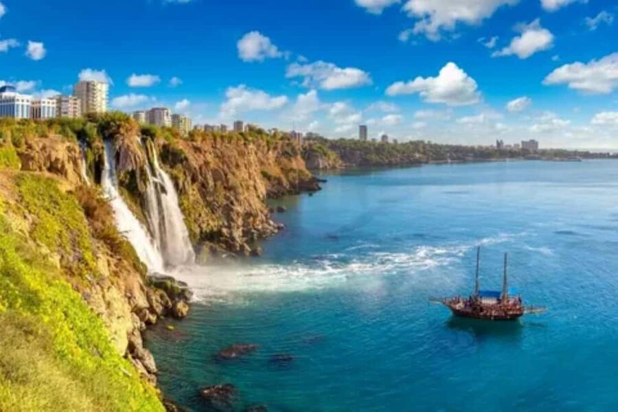 Antalya Boat Tour: Düden Waterfall, Swim & Soft Drinks - Cruising past Lara Bay: caves, cliffs, and the calm parts you actually notice
